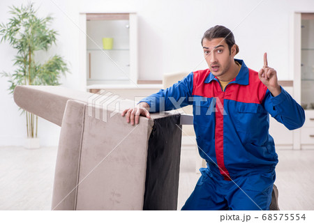 Young male carpenter working indoors Young male carpenter working indoors 68575554