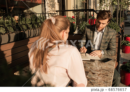 businessman working at the table in open coffee businessman working at the table in open coffee 68576657
