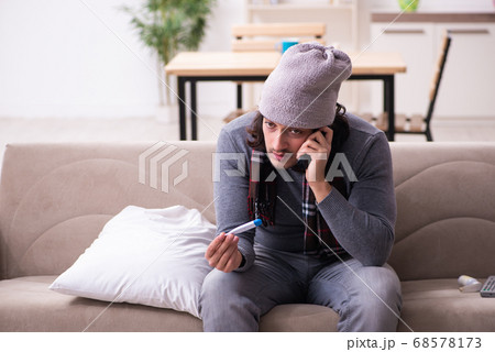 Young man suffering at home 68578173