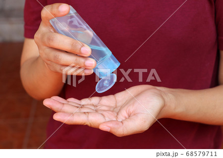 Dropping of alcohol gel from the plastic bottle for wash the hand Dropping of alcohol gel from the plastic bottle for wash the hand 68579711