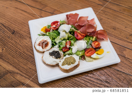Ricotta Bruschetta with Italian salad and mozzarella cheese Ricotta Bruschetta with Italian salad and mozzarella cheese 68581851
