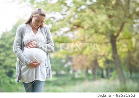 Expecting woman in nature Expecting woman in nature 68581852