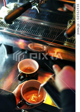 making espresso coffee close up detail with modern 68582438