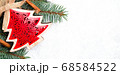 Christmas decorations and branches of a New Year tree on abstract background 68584522