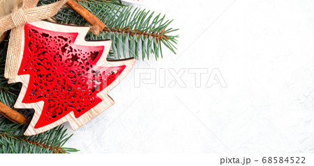 Christmas decorations and branches of a New Year tree on abstract background Christmas decorations and branches of a New Year tree on abstract background 68584522