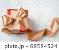 Christmas gift, red box with a golden bow, can also be used as a gift for St. Valentine's Day and birthday 68584524