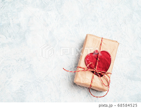 Valentine's Day Gift box with a red bow and heart Valentine's Day Gift box with a red bow and heart 68584525