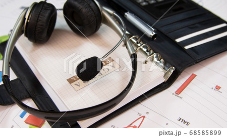 Agenda and headset close-up. Business background. 68585899