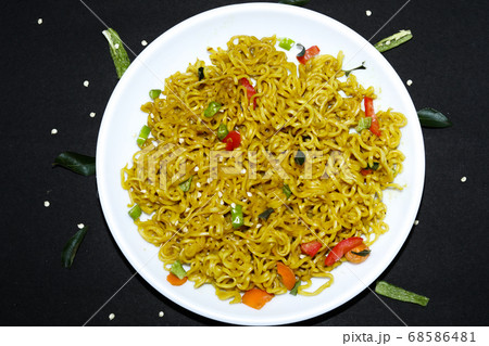 Vegetarian Schezwan Noodles or Vegetable Hakka 68586481