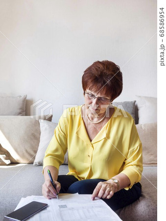 white adult woman in a yellow blouse assorts 68586954