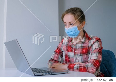 Woman looking at laptop, having video chat with friends at home 68587180