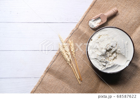 Production of wheat and rye flour on white desk Production of wheat and rye flour on white desk 68587622