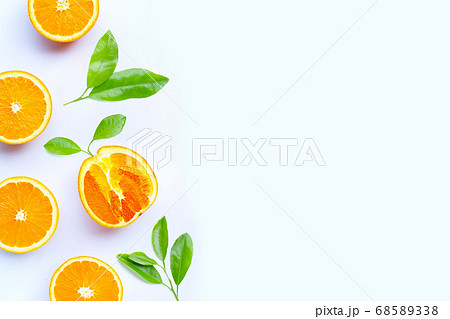 Orange fruit with leaves on white background. 68589338