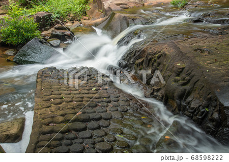 Kbal Spean the mystery waterfall on Kulen mountains range of the ancient Khmer empire in Siem Reap province of Cambodia. Kbal Spean the mystery waterfall on Kulen mountains range of the ancient Khmer empire in Siem Reap province of Cambodia. 68598222