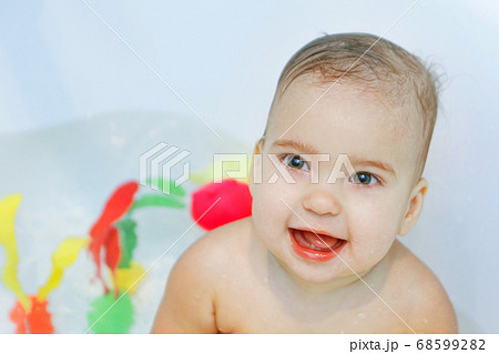 little girl bathing Adobe Stock