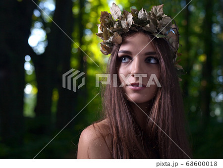 woman in dark forest 68600018