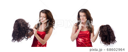 Woman with a selection of wig isolated on white Woman with a selection of wig isolated on white 68602964