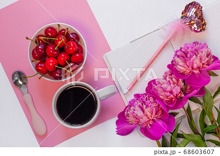 Still life with cup of coffee, sweet cherries and 68603607