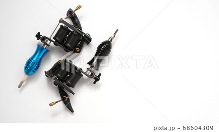 Two tattoo machines on a white background - space for text Two tattoo machines on a white background - space for text 68604309