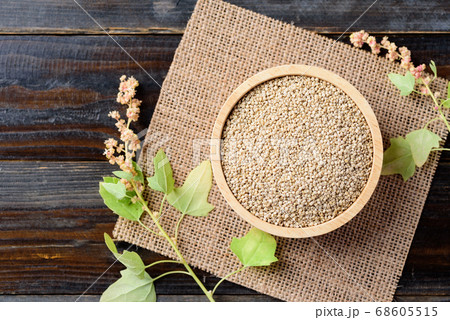 Raw brown quinoa seed in bowl on wooden background, Healthy food Raw brown quinoa seed in bowl on wooden background, Healthy food 68605515