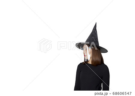 Woman wearing witch costume and mask face shield Woman wearing witch costume and mask face shield 68606547