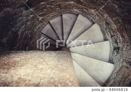 top wiew of an ancient stone spiral staircase top wiew of an ancient stone spiral staircase 68606819