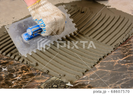 Close-up of a master's hand that makes furrows in Close-up of a master's hand that makes furrows in 68607570