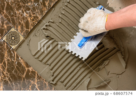 Close-up of a master's hand that makes furrows in Close-up of a master's hand that makes furrows in 68607574