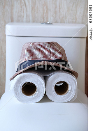 roll of toilet paper and hat, close up  68607691