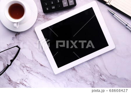 Top view of digital tablet with screen on desk  68608427