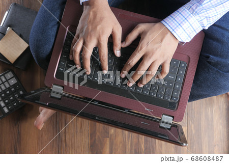 Work from home concept, young man typing on laptop  68608487