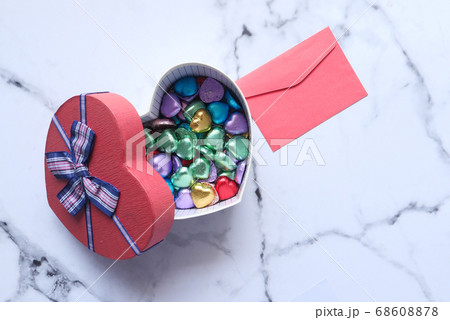 heart shape gift box, candy and letter on tiles background heart shape gift box, candy and letter on tiles background 68608878