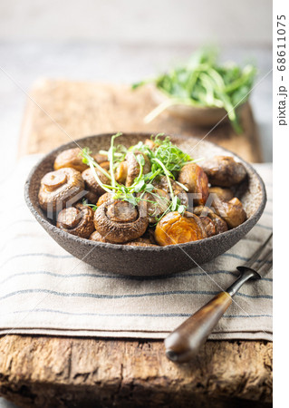 Baked champignons mushrooms Baked champignons mushrooms 68611075