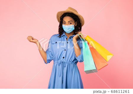 African American Girl On Shopping Wearing Face Mask, Pink Background 68611261