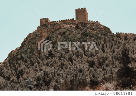Castle of Sax on rocky mountain top, Spain 68611381
