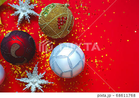 Beautiful Christmas balls and stars on a red 68611768