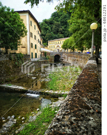 vertical river in italy town village of Porretta near Bologna in Emilia Romagna vertical river in italy town village of Porretta near Bologna in Emilia Romagna 68612291