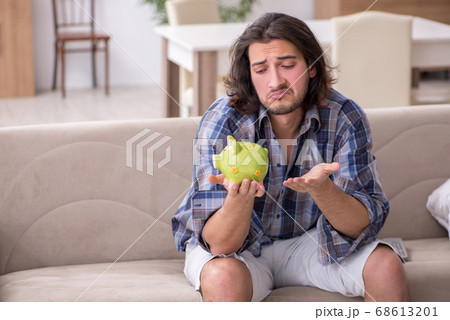 Young male student in poverty concept Young male student in poverty concept 68613201