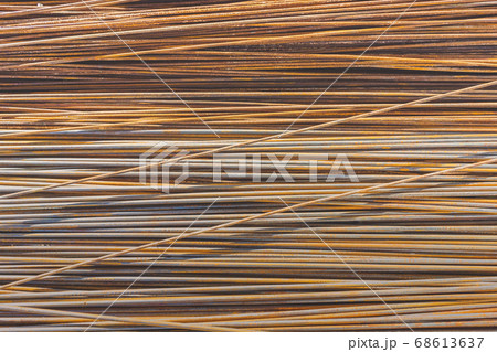 Background texture of old rusty steel bars construction materials in a construction site 68613637