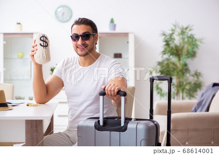 Young man preparing for departure at home Young man preparing for departure at home 68614001