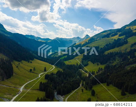 Aerial view into the valley head of the Hinterglemm Mountains on a summer day in the Alps at Saalbach-Hinterglemm, Austria Aerial view into the valley head of the Hinterglemm Mountains on a summer day in the Alps at Saalbach-Hinterglemm, Austria 68614211