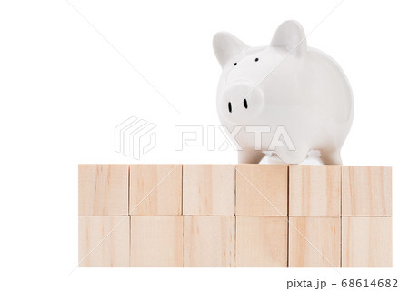 Wood cubes and piggy bank isolated on white Wood cubes and piggy bank isolated on white 68614682