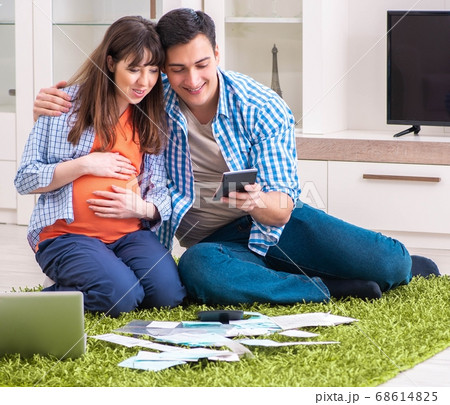 Young family in budget planning concept Young family in budget planning concept 68614825