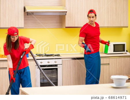 Cleaning professional contractors working at kitchen 68614971