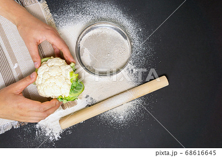 Cauliflower flour and vegetables on the cutting Board. Health food. top view of flat lay Cauliflower flour and vegetables on the cutting Board. Health food. top view of flat lay 68616645