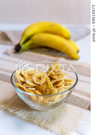 banana a bowl full of dried banana chips. healthy snacks 68616673