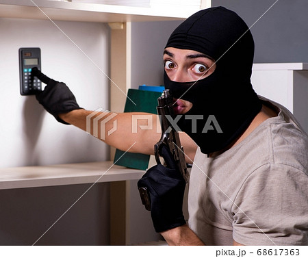 ski mask robber with gun