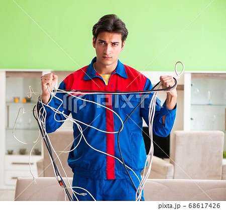 Electrician contractor with tangled cables 68617426