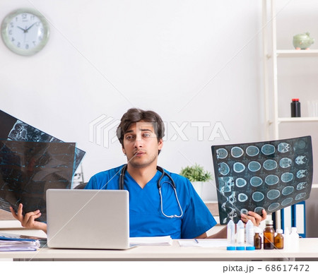 Male doctor radiologist with x-ray can image 68617472