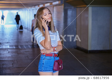 Beautiful caucasian woman at underground crossing. Beautiful caucasian woman at underground crossing. 68617956